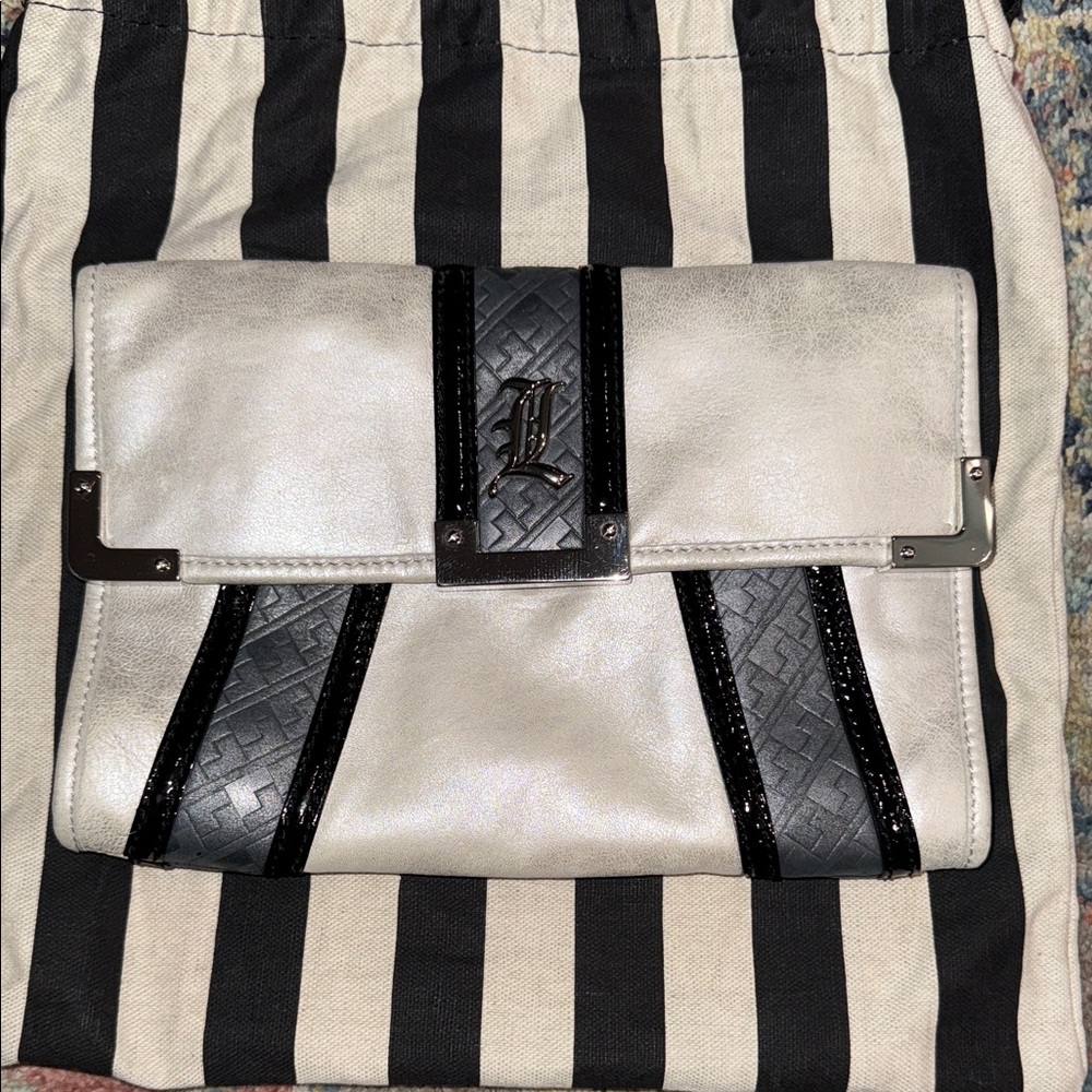 L.A.M.B. Black and Pearl leather clutch adorned